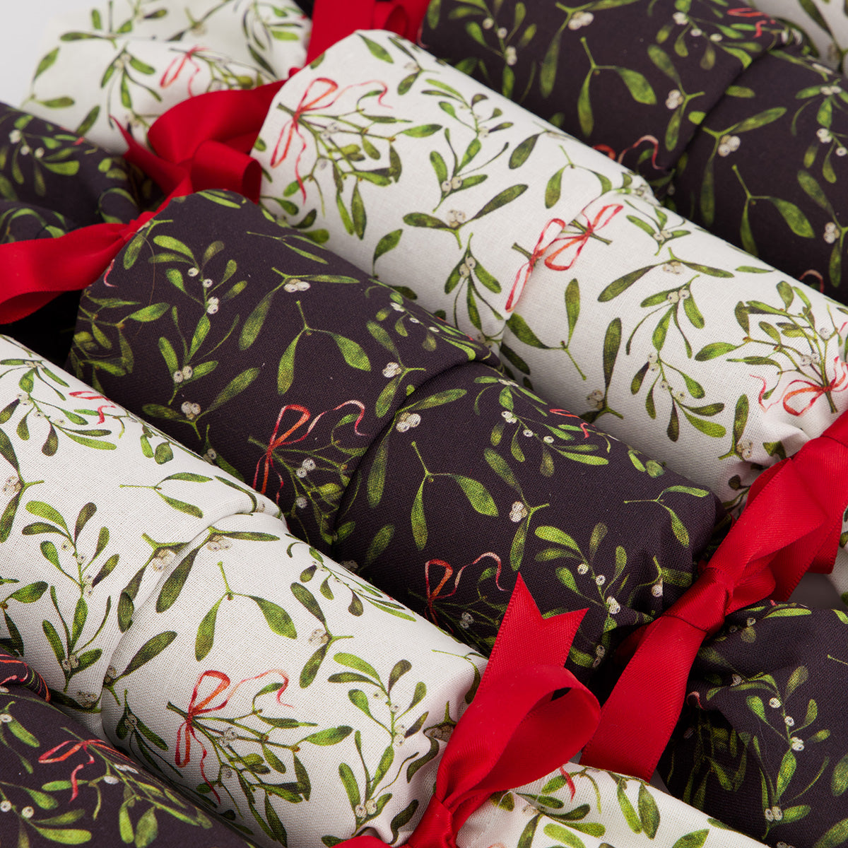 Mistletoe reusable Christmas cracker — close-up of mistletoe and berries fabric detail