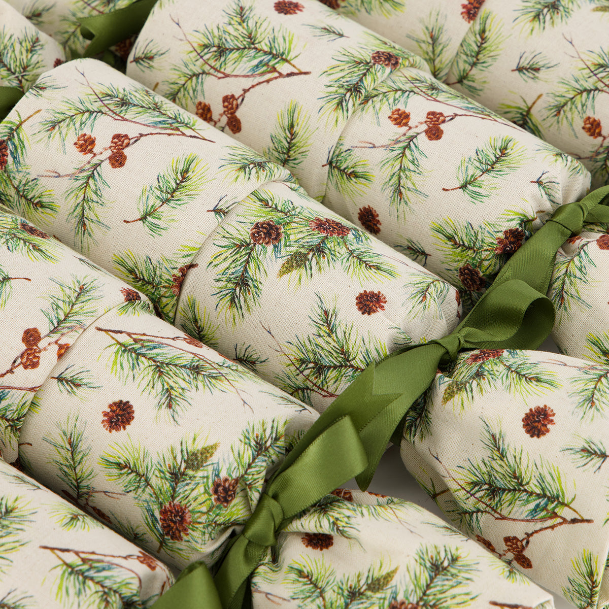 Giuthas na Nollaige reusable Christmas cracker — close-up of pine branch and pinecone fabric detail